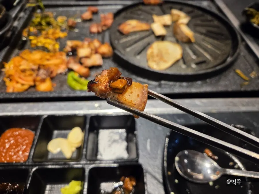 Sliced potato grilled on the plate wrapped with meat