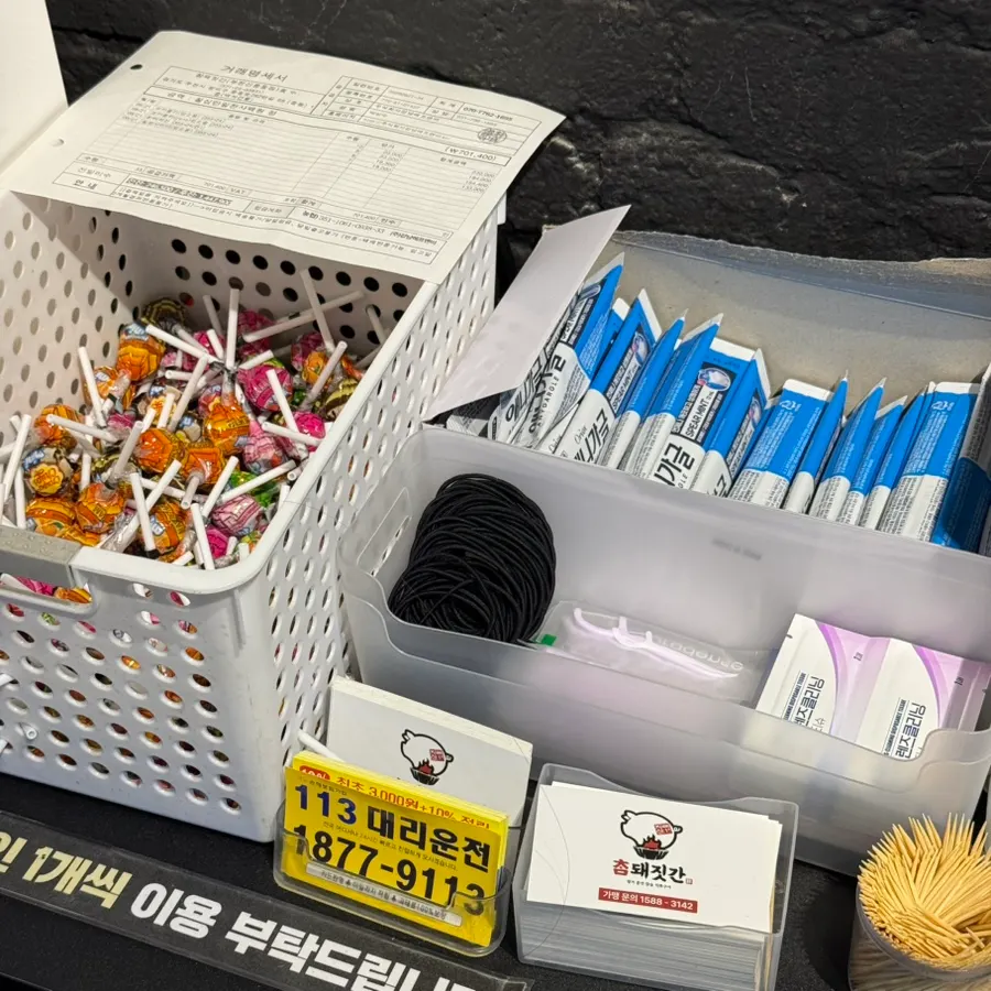 Hair ties, floss, and glasses cloths ready at the checkout counter