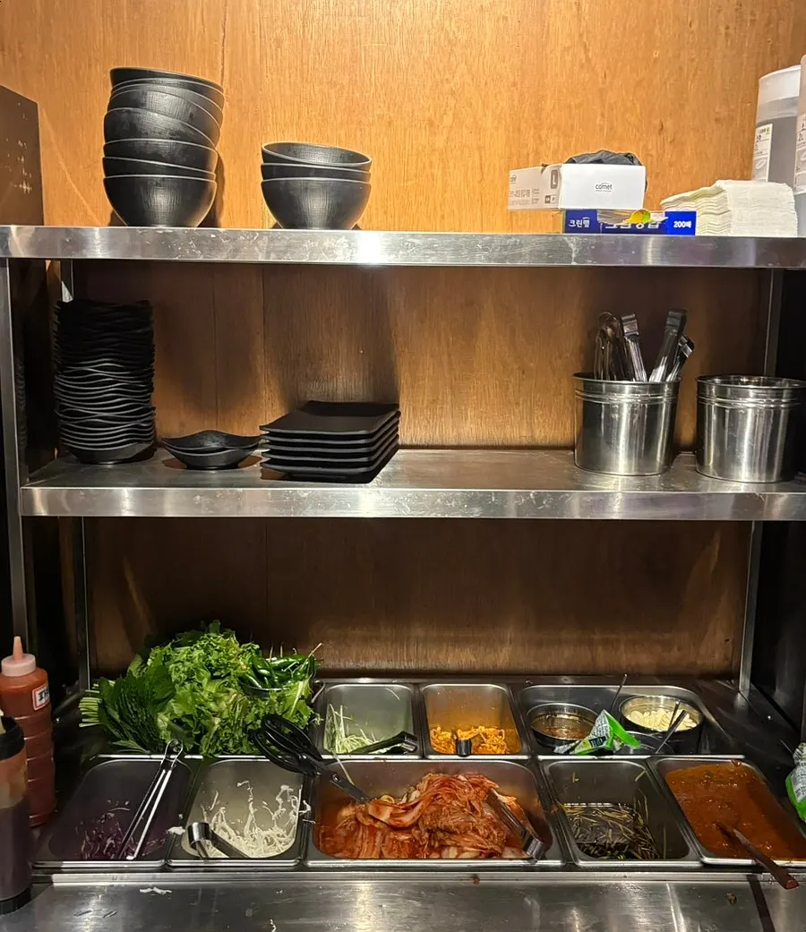 Self-serve bar with lettuce wraps and side dishes