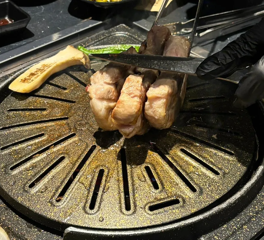 Close-up of golden-brown grilled pork belly