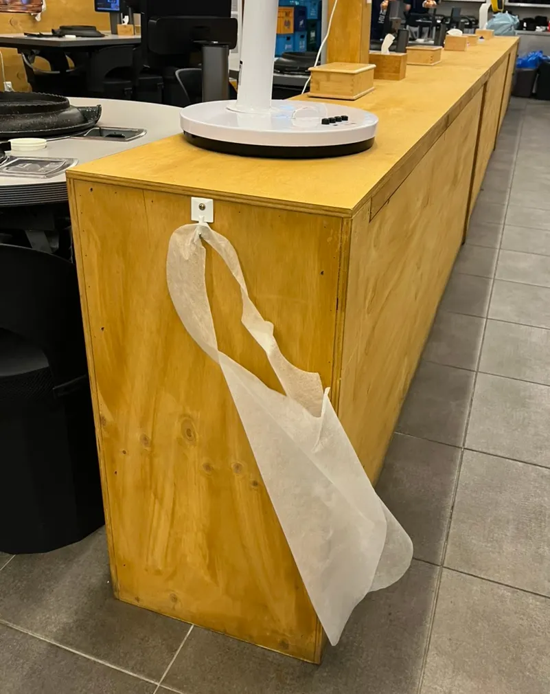 Wearing a disposable apron