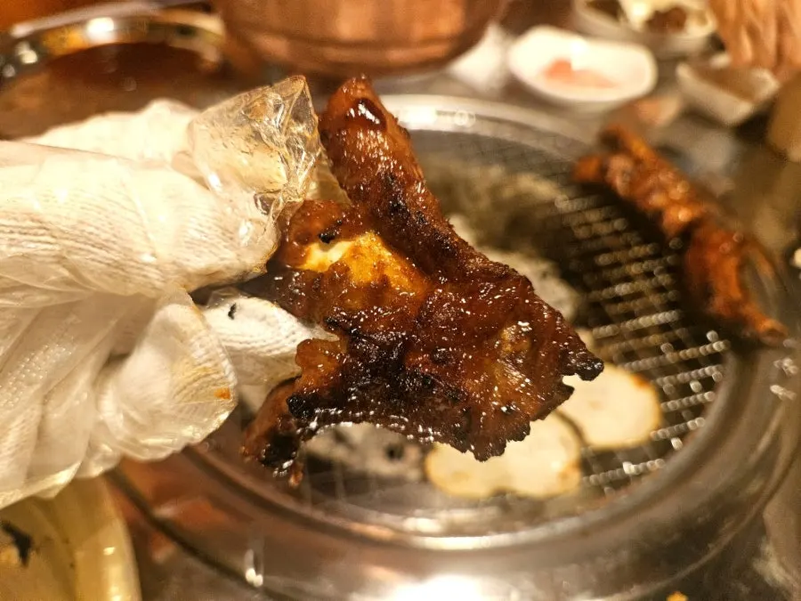 Soy pork ribs grilling on the grill plate