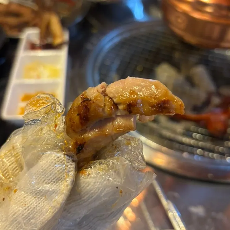 Tender jjokgalbi dipped in the spicy seasoned sauce