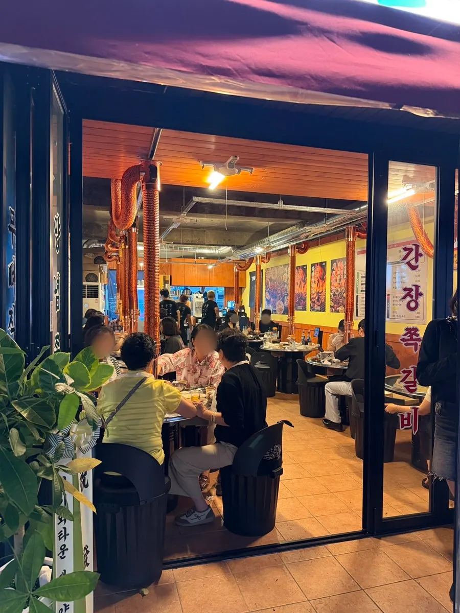 Interior of Champpoppo Jjokgalbi Hapjeong Branch packed with customers