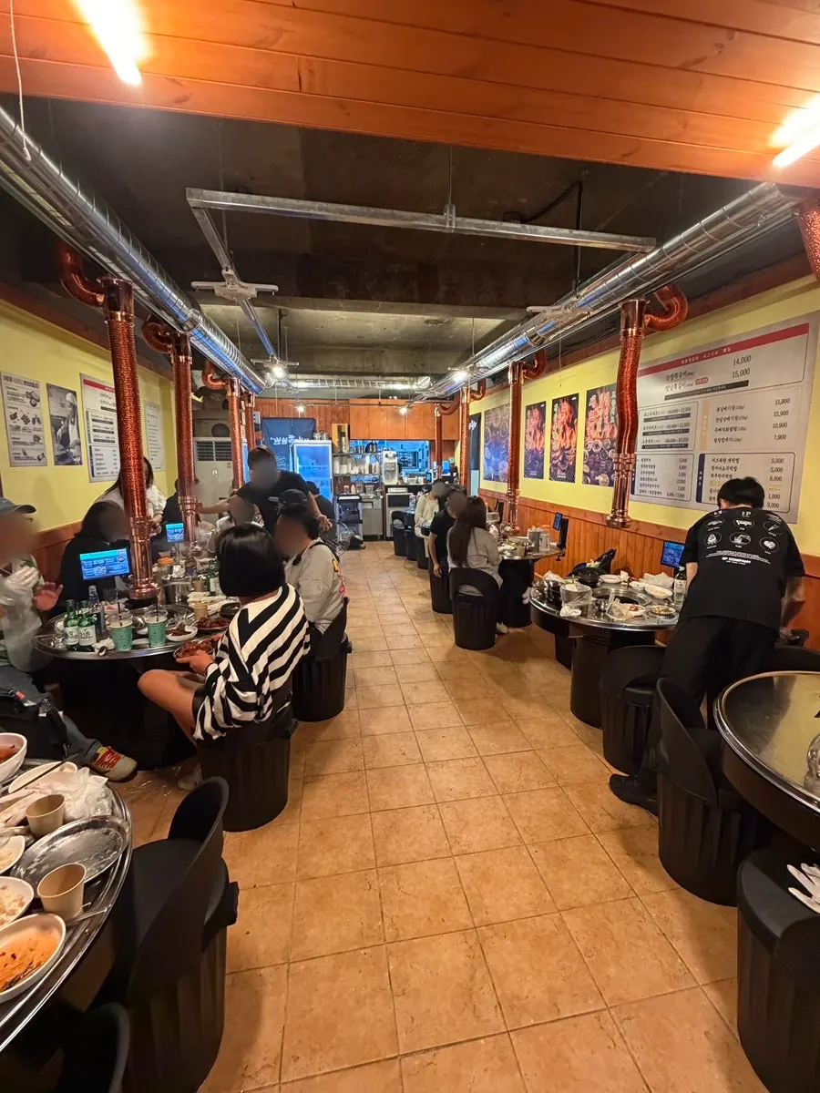 View of tables and seating at Champpoppo Jjokgalbi Hapjeong Branch