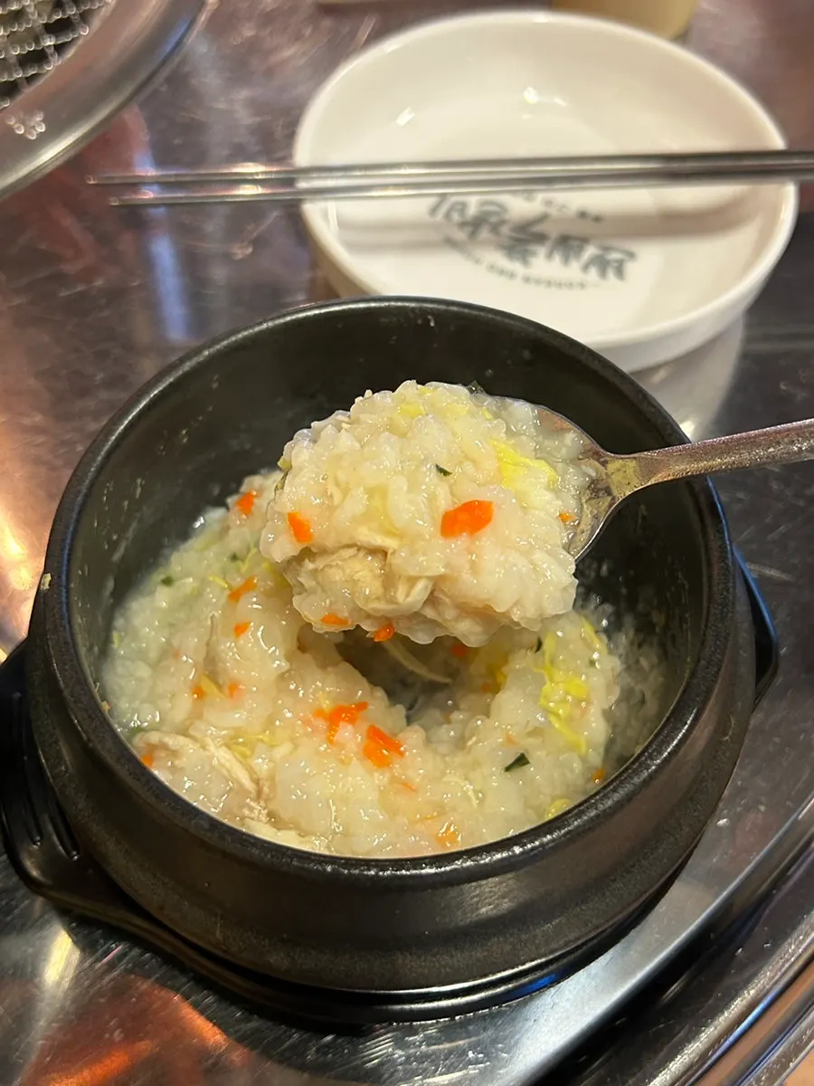 Complimentary chicken porridge with pieces of chicken