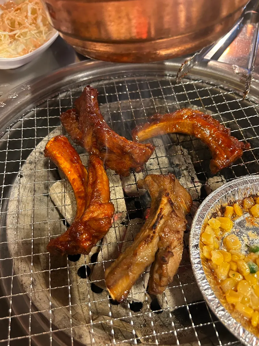 Soy pork ribs cooking on the grill