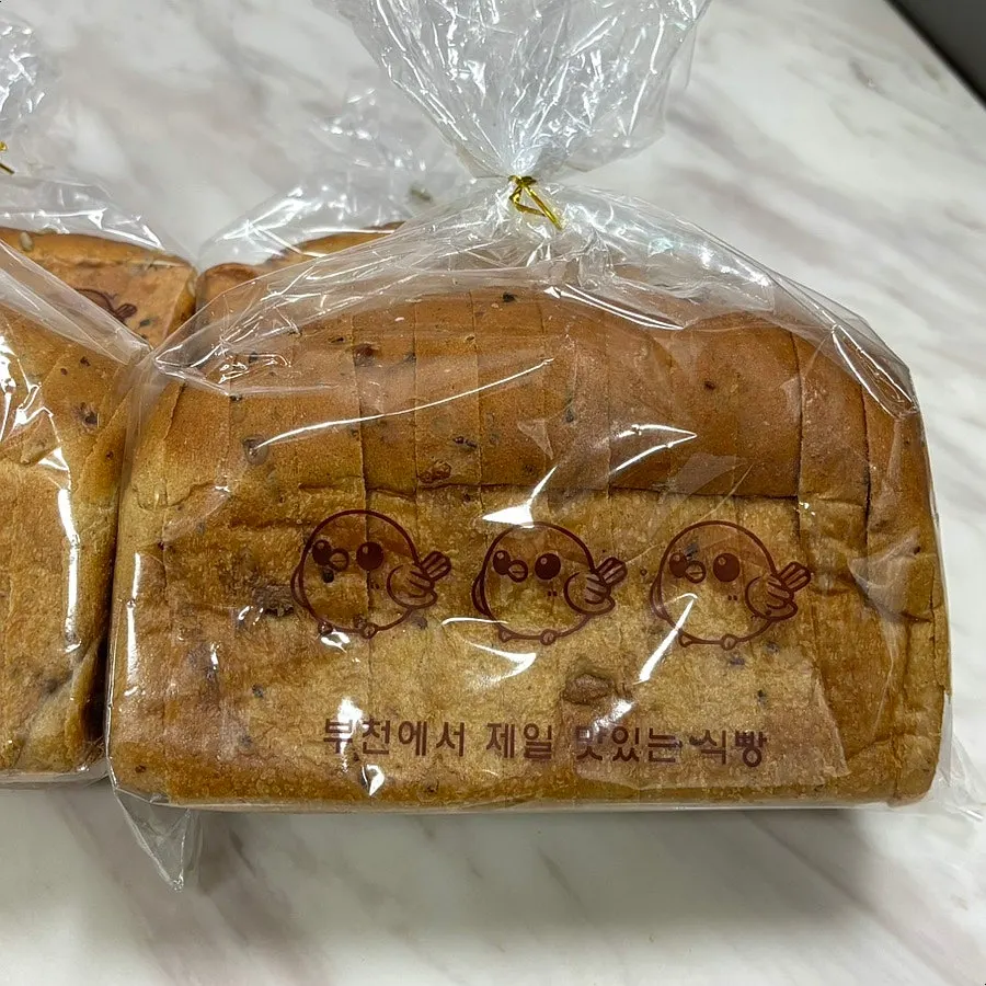 Hand-torn chapbori bread showing its chewy texture