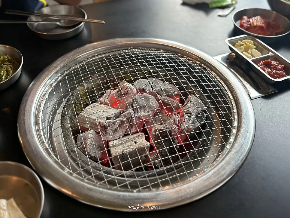 A charcoal grill plate set on the table