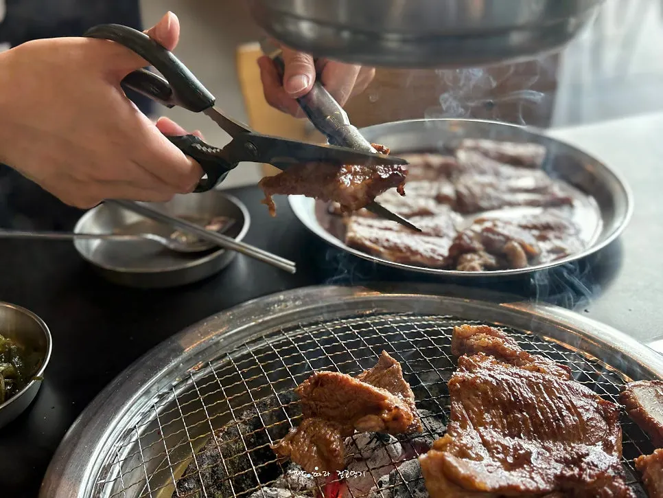 Seasoned pork ribs grilling over charcoal