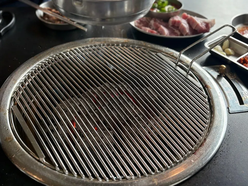 Pork belly placed on a fresh grill plate