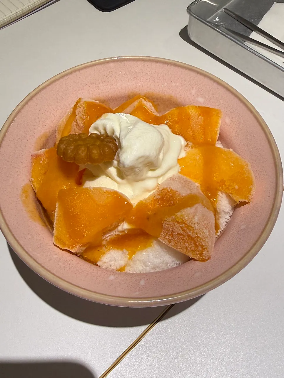 Snowflake ice persimmon bingsu topped with persimmon and yakgwa