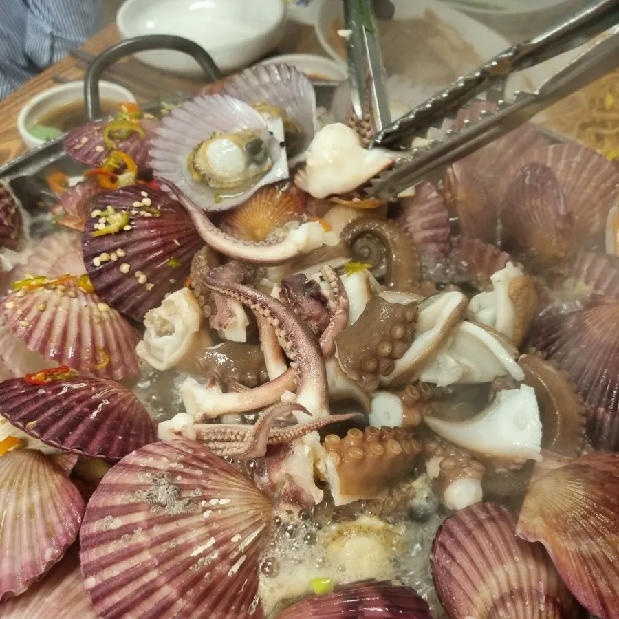 Mussels and clams opened up in the seafood stew