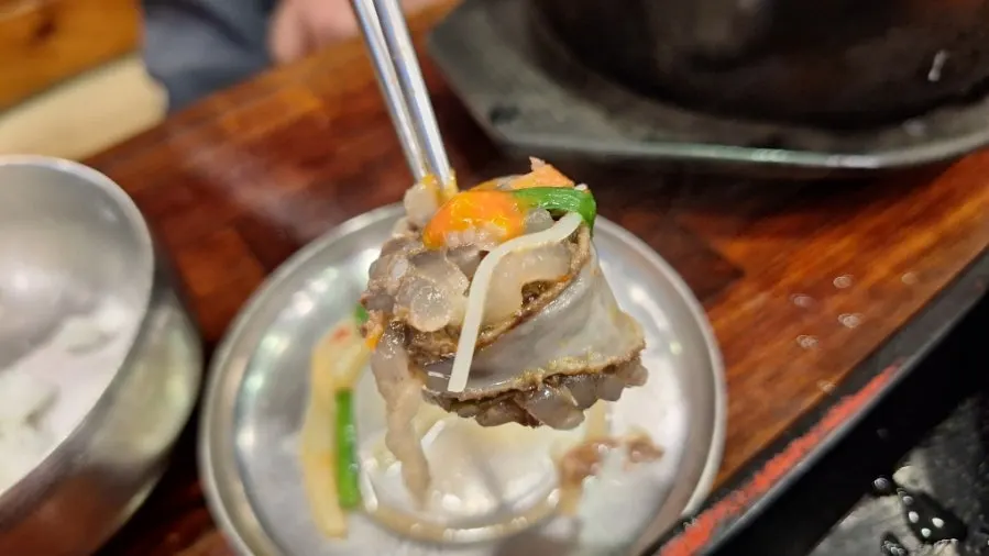 A piece of sundae lifted out of the soup