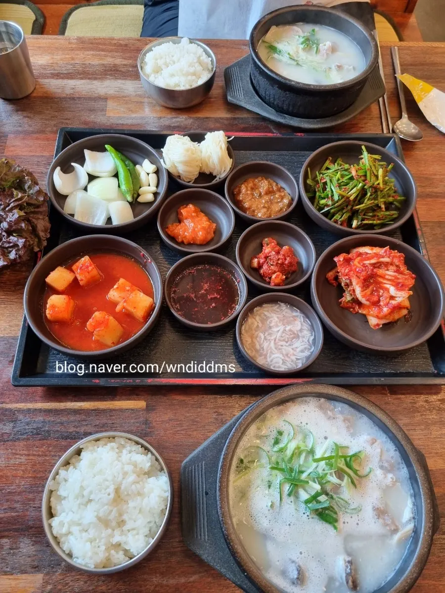 Full spread of mixed gukbap and side dishes