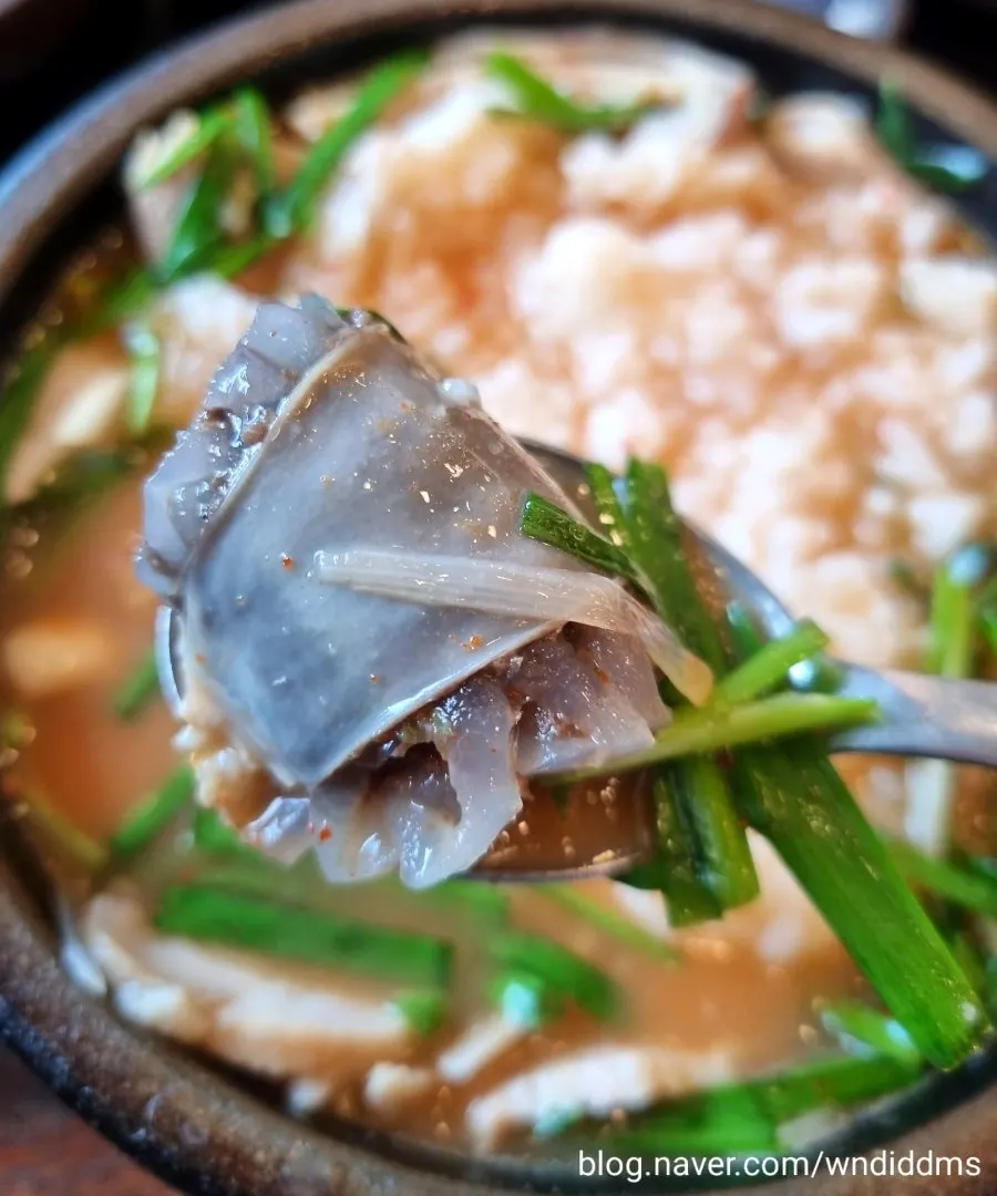 Gukbap with seasoned chili paste and dressed chives added