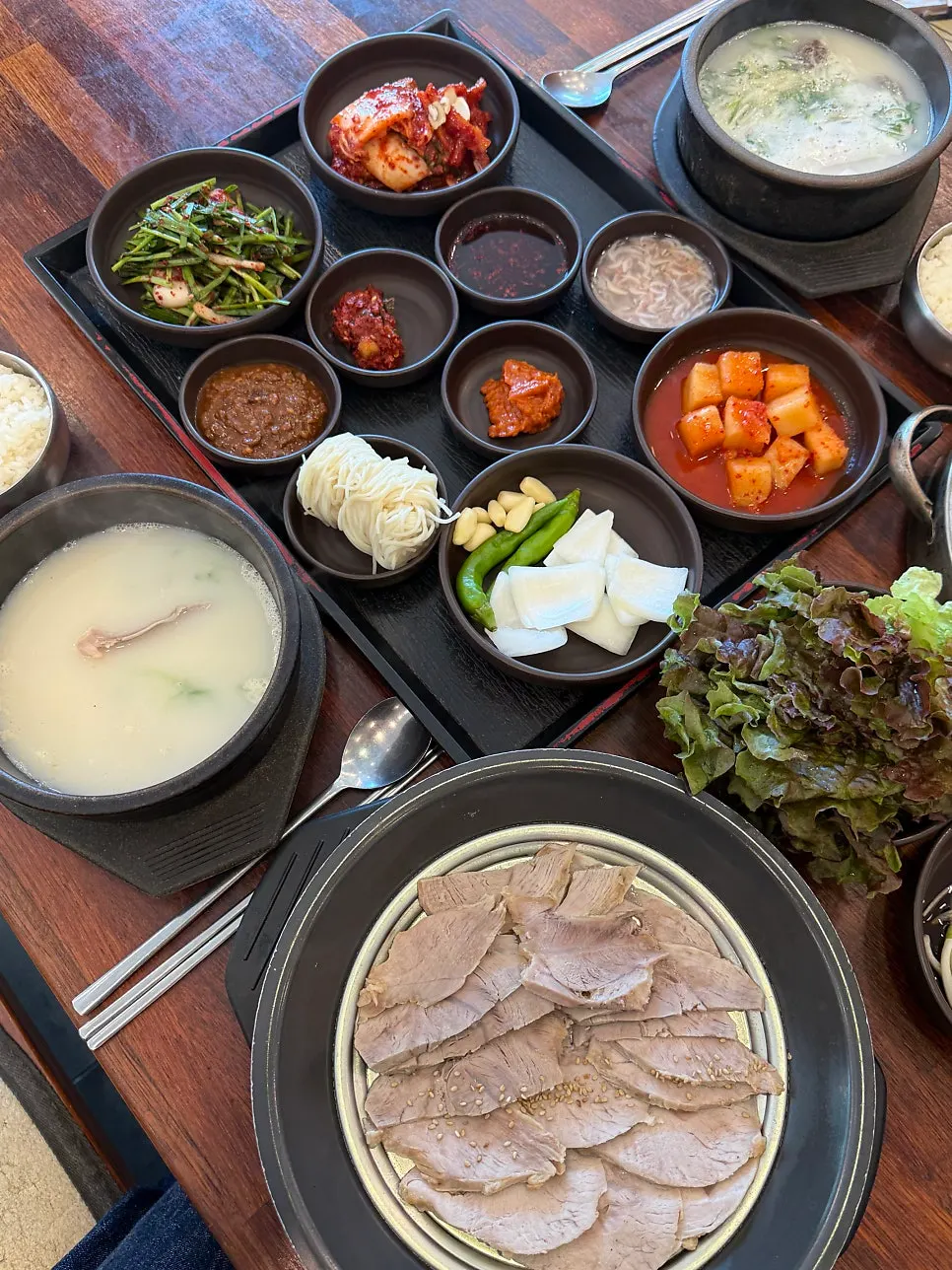 Suyuk baekban and sundae gukbap set on the table