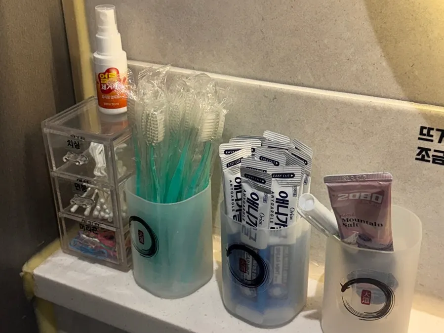 Well-stocked sink area in the Daedo Jangeo restroom