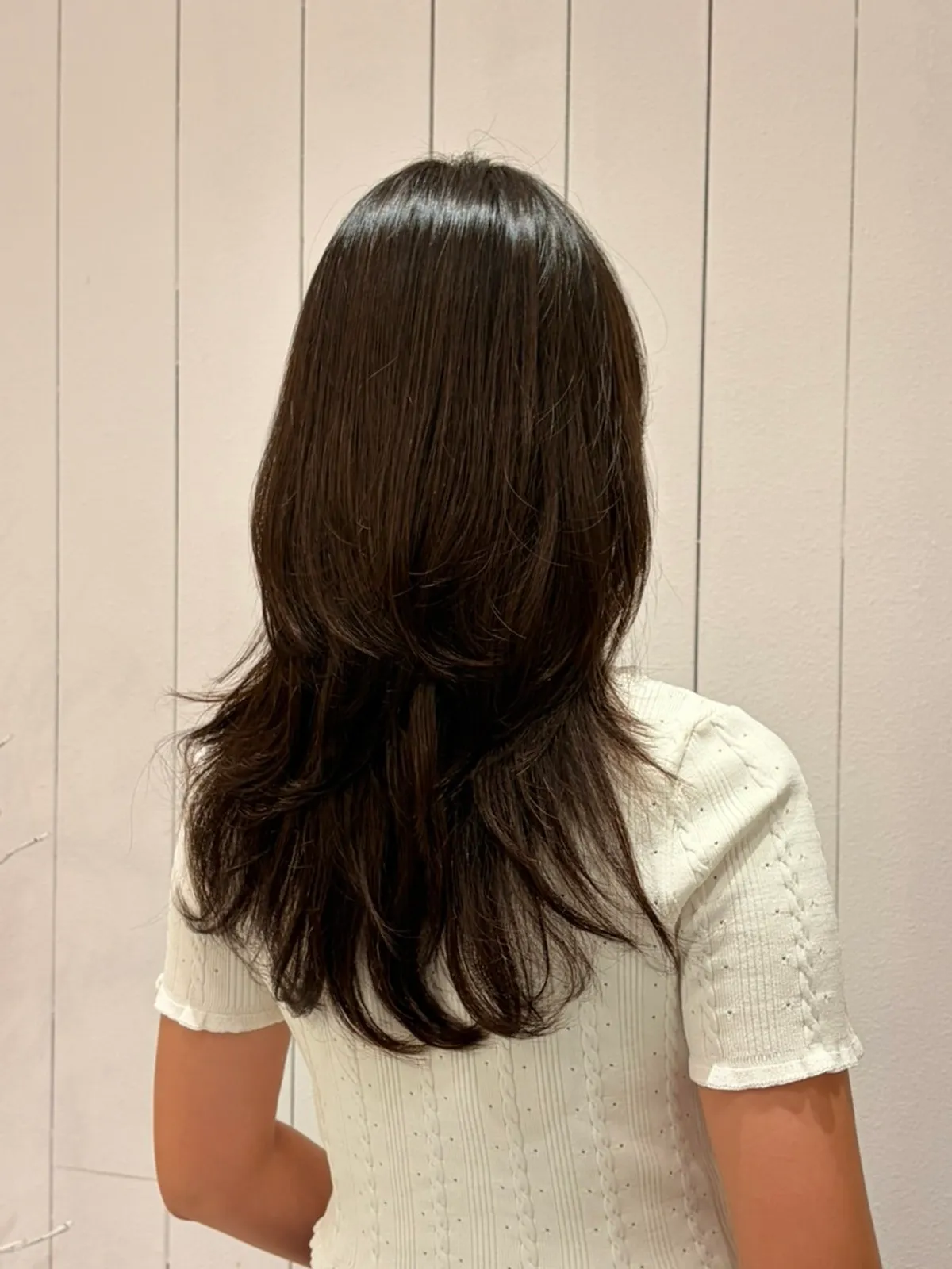 Finished high-layered C-curl perm style