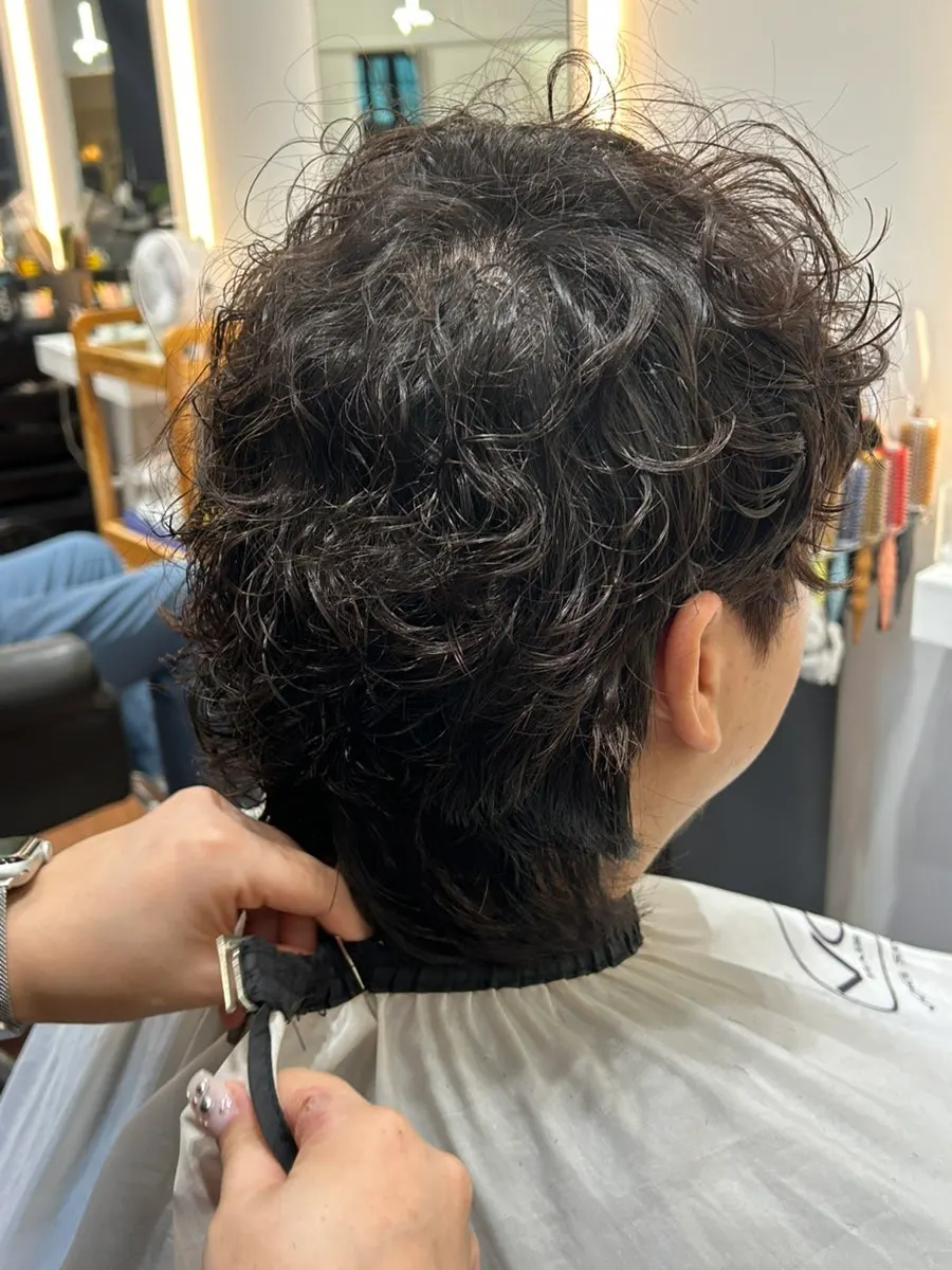 Finished men’s hippie perm hairstyle