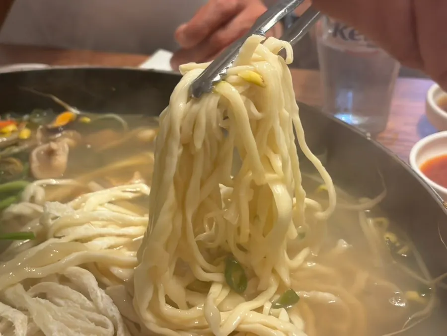 Kalguksu noodles boiled in leftover seafood broth