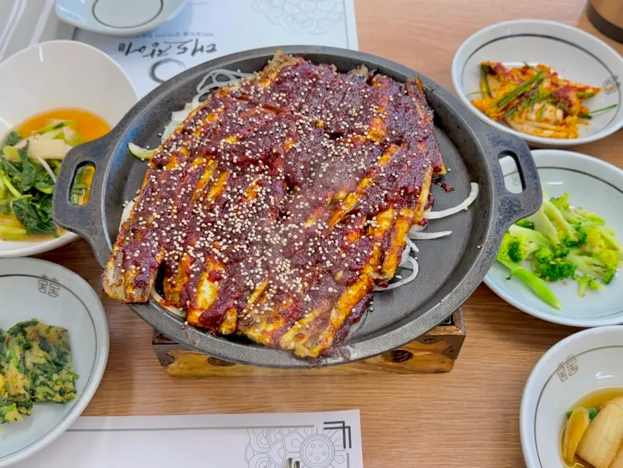 Plate of golden-brown grilled eel