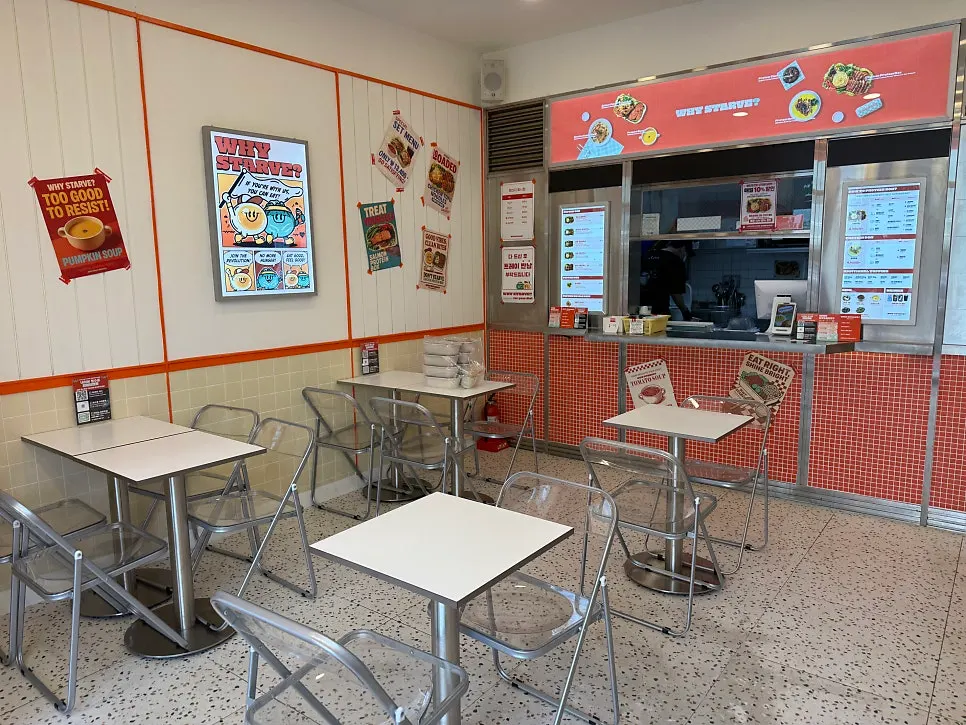 Store entrance with orange signage visible