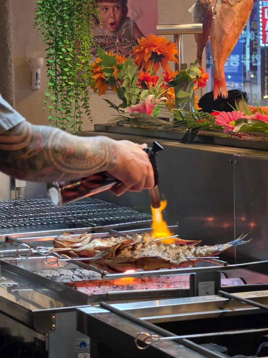 Fish grilled with real charcoal and a torch