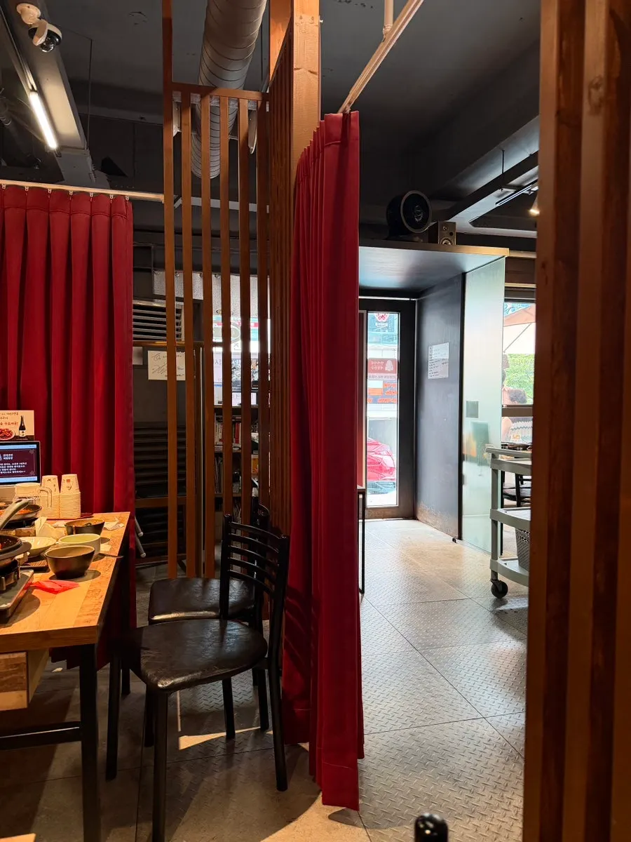 Group dining space separated by curtains