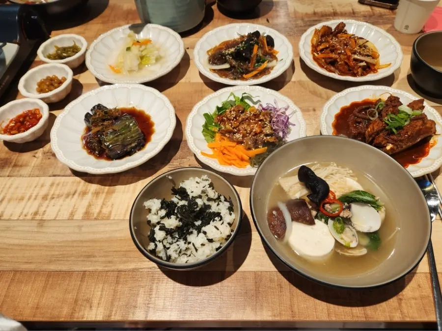 Table fully set with the 10-dish spread