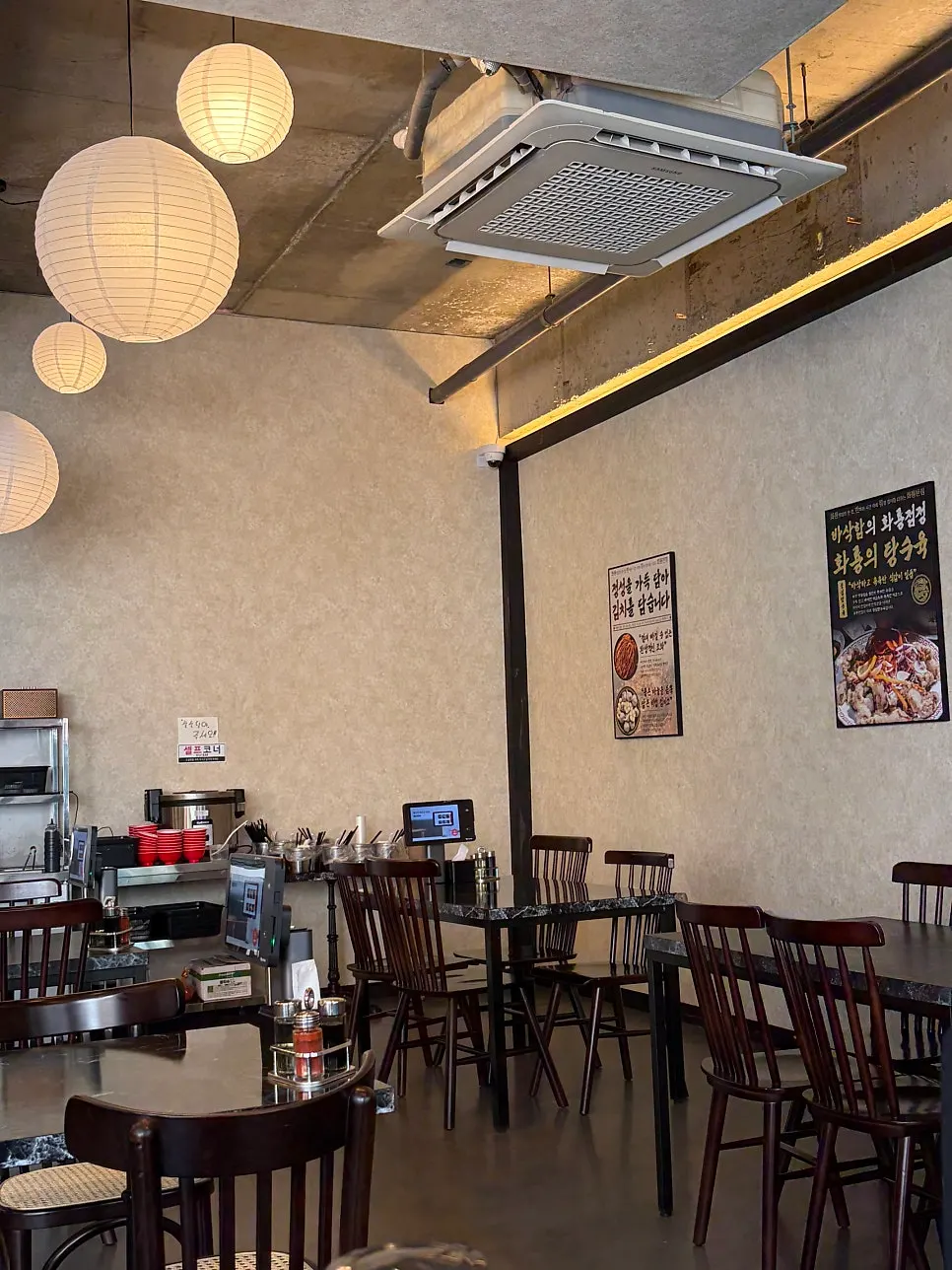 Signature menu items posted on the wall at Hwaryong Restaurant