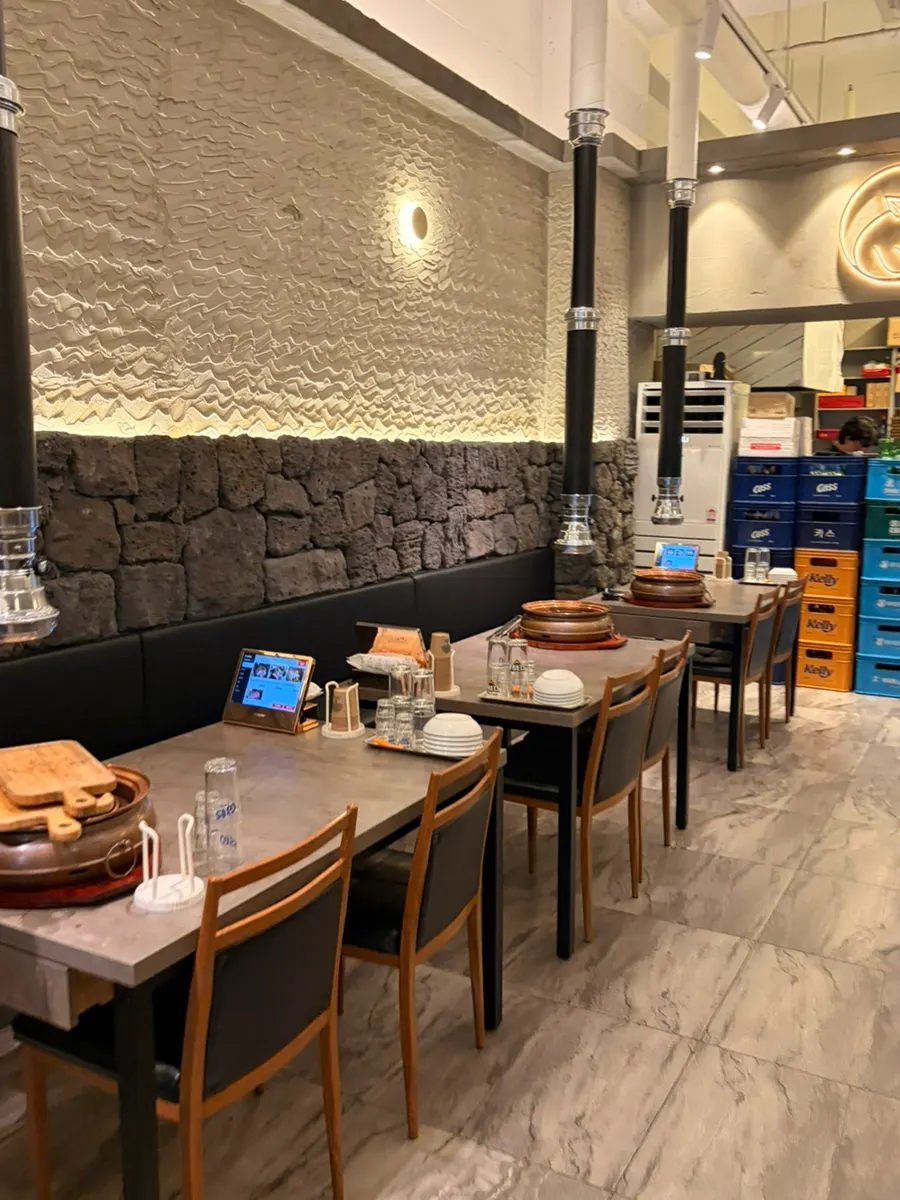 Spacious restaurant interior with four-person tables
