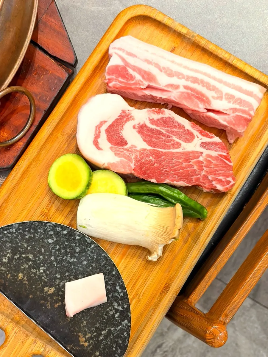 Uncooked black pork with visible marbling