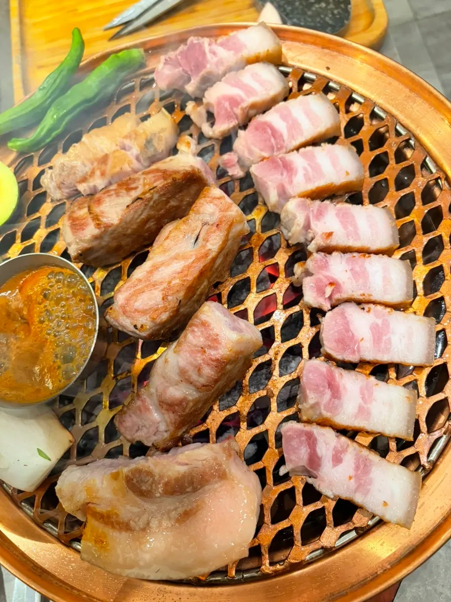 Cut black pork filling the grill plate