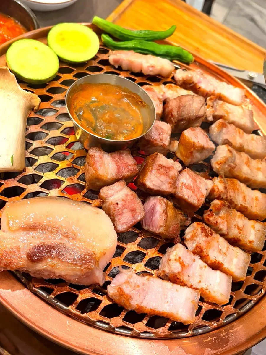 Fully cooked black pork placed on a stone plate