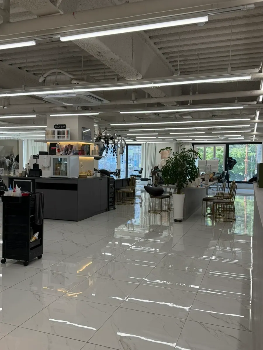 White-toned salon interior with seating