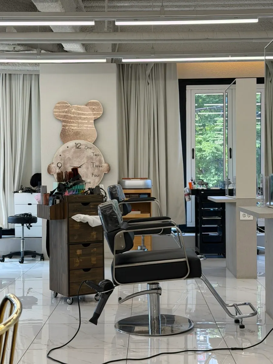 Bright salon interior with floor-to-ceiling windows