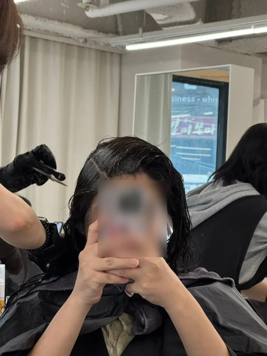 Hair with root color dye applied