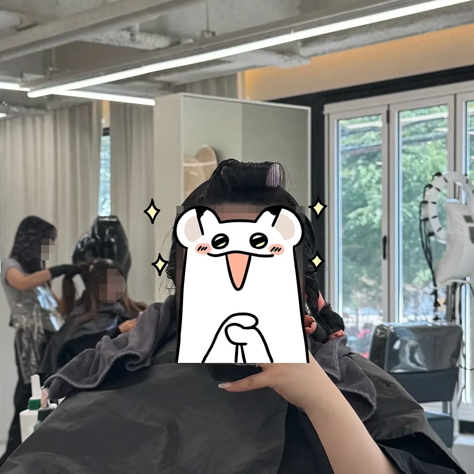 Flat-ironing the top layer of hair