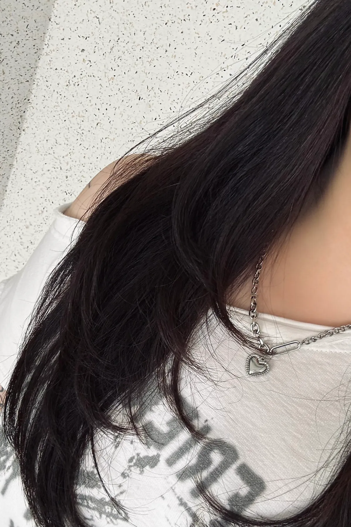 Finished long hairstyle with layered cut and C-curl perm