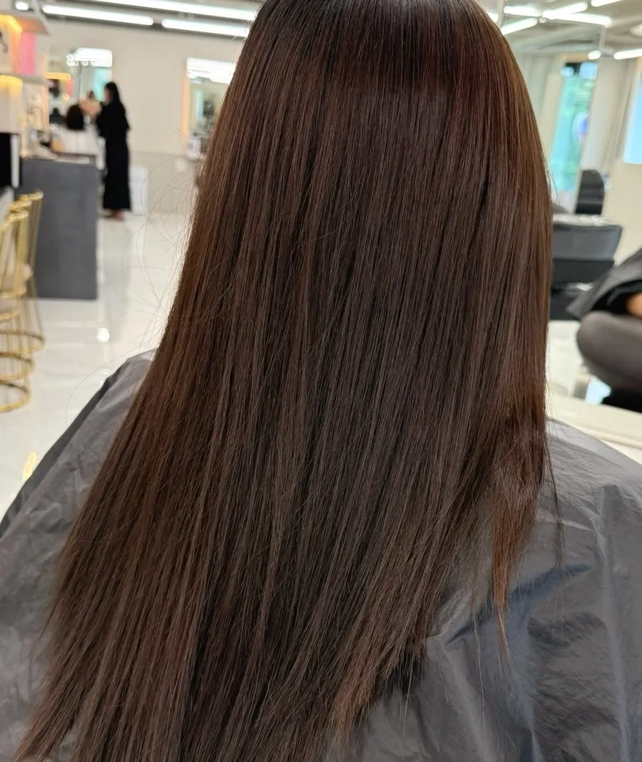 Hair before coloring, with red tones still visible