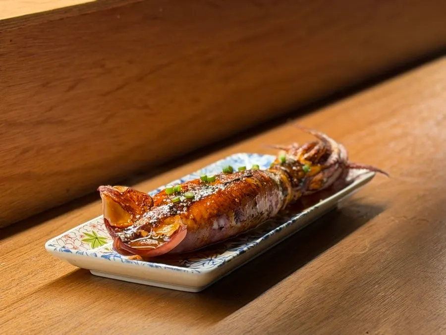 A whole squid grilled and served uncut