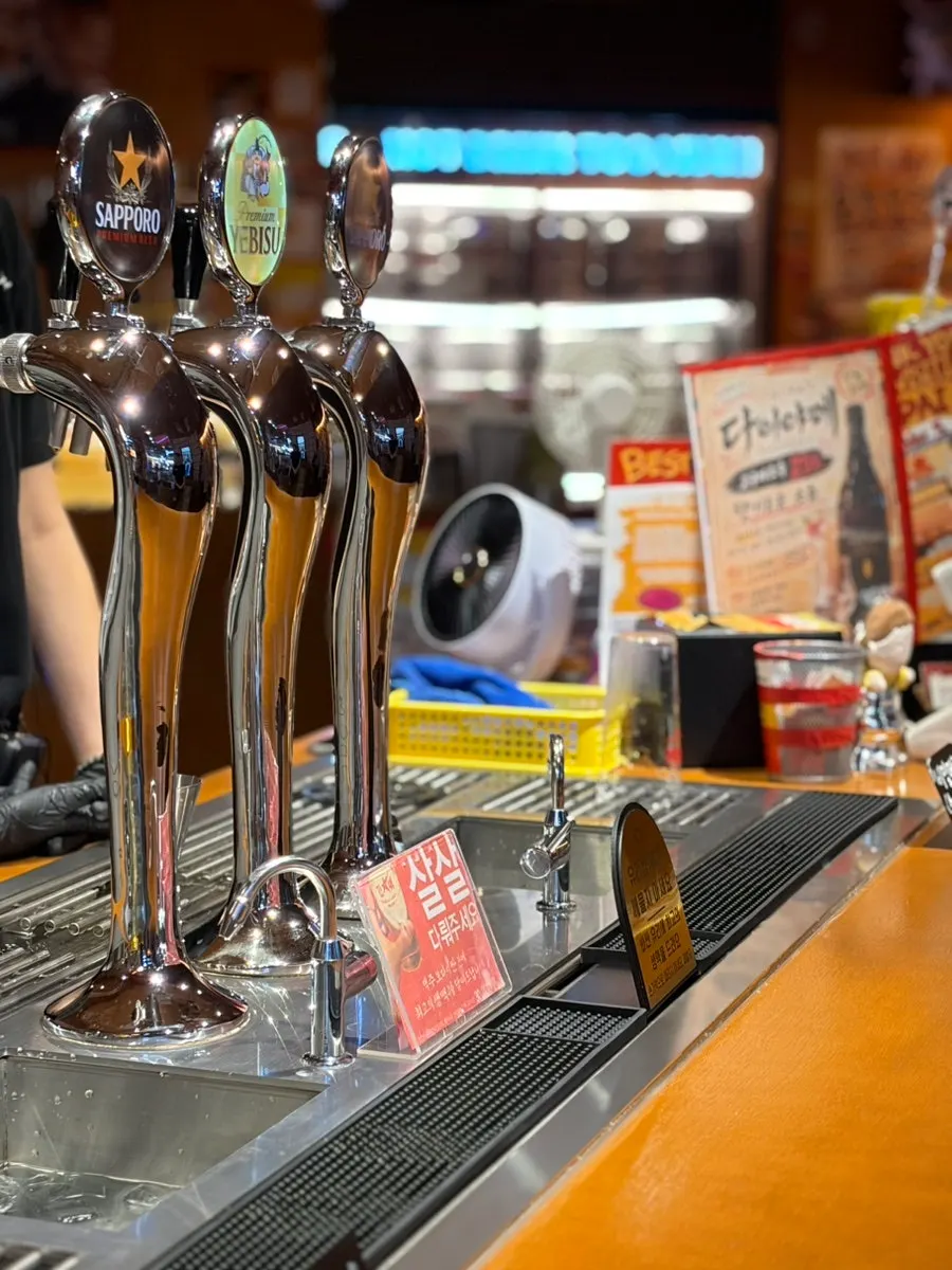 Beer being poured through a short tube