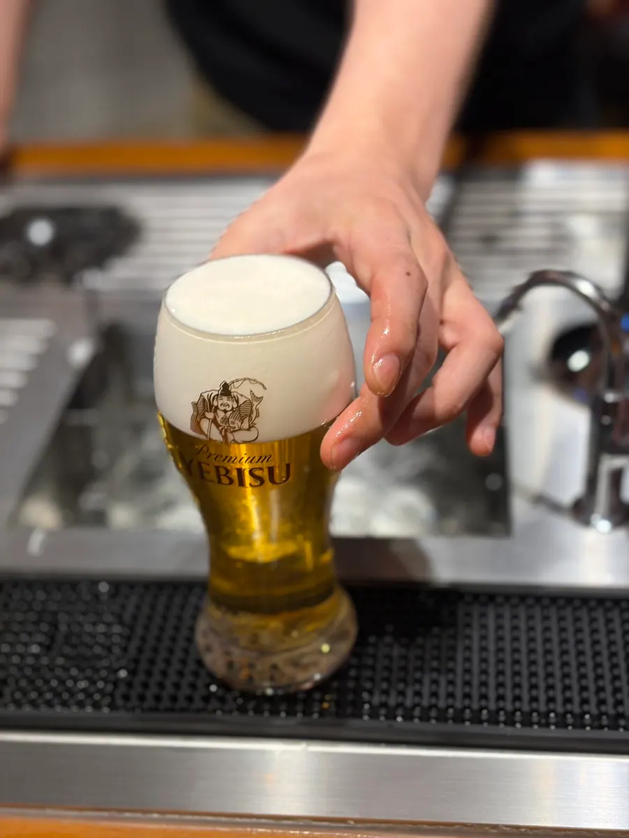 Sapporo draft beer poured at the bar