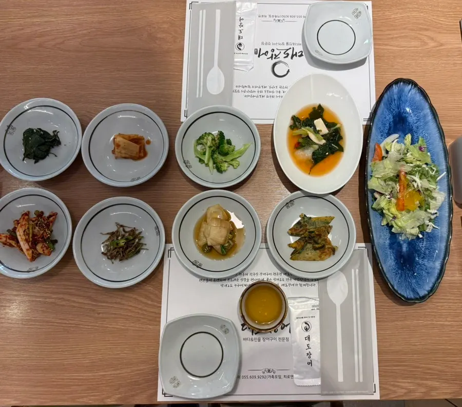 Generous spread of Daedo Jangeo's basic side dishes