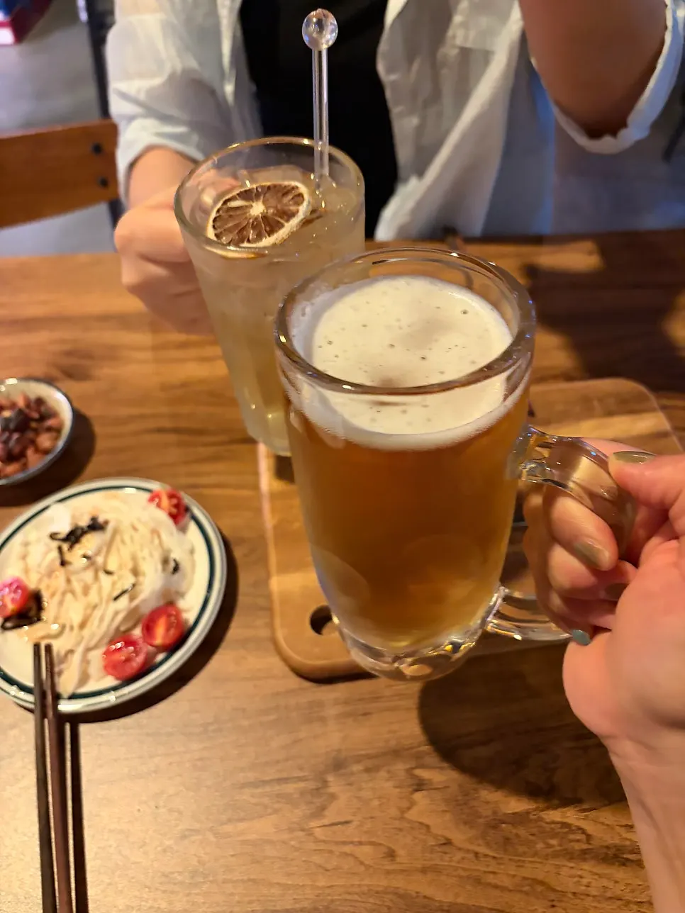 Two glasses of draft beer and highball