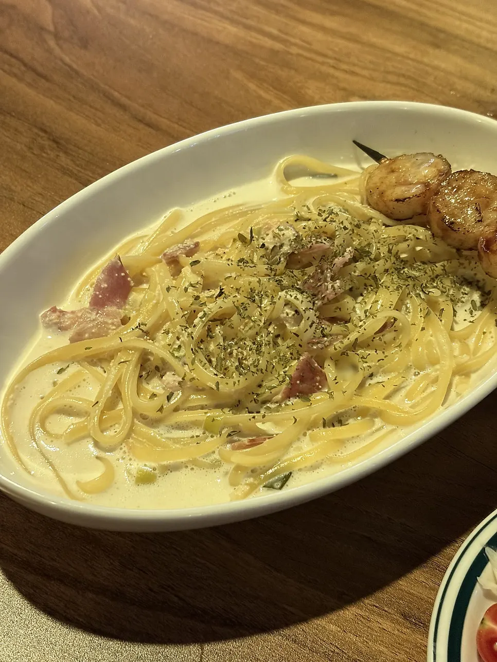 A plate of mentaiko scallop cream pasta