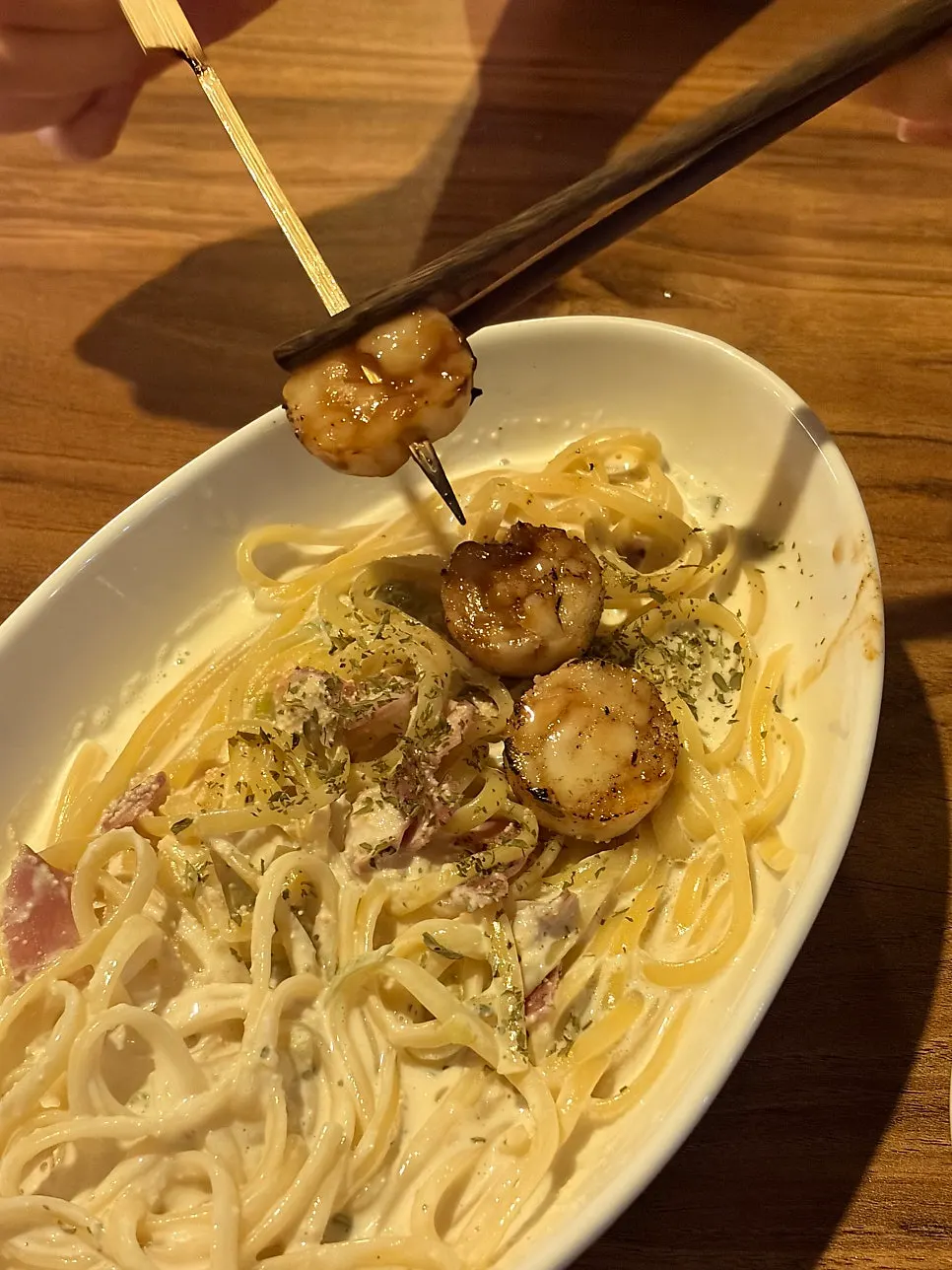 Scooping up a bite of the pasta