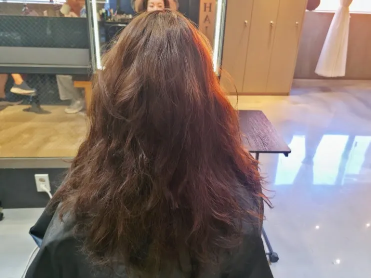 Hair ends with loose curls before treatment