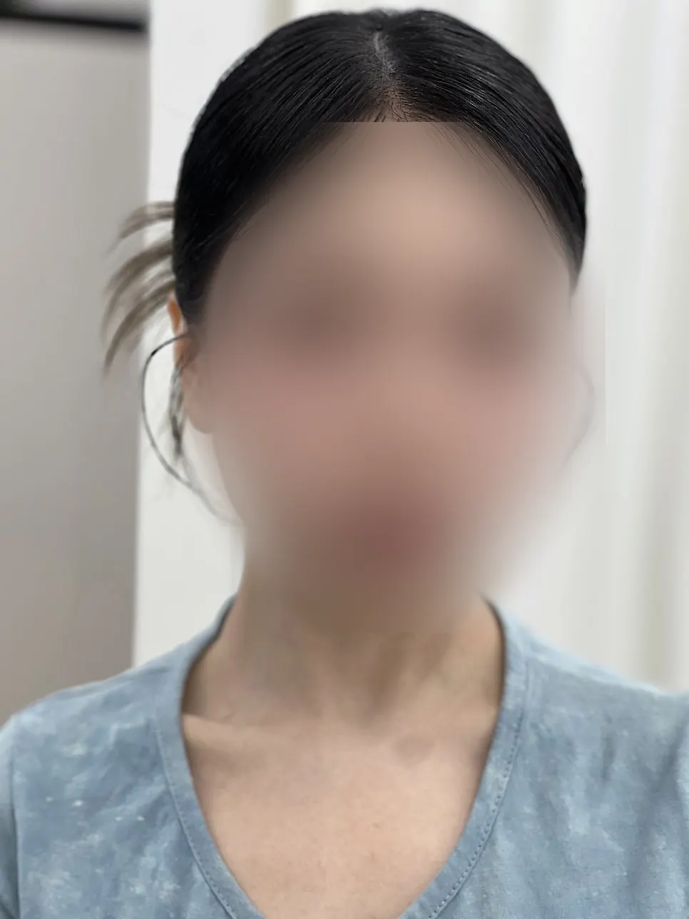 Finished low bun hairstyle and makeup
